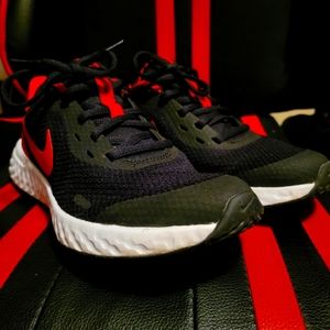 Black and Red Nike Revolution Sneakers